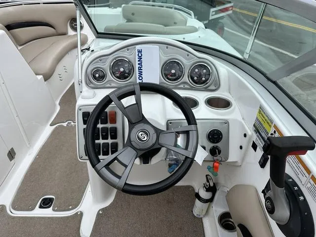 Slide: The Image of 2015 Hurricane SD 2400 I/O boat dashboard with steering wheel and control panel. - 22