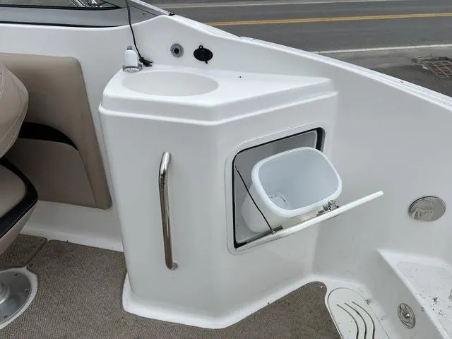 Slide: The Image of 2015 Hurricane SD 2400 I/O boat interior with sink and storage compartment. - 26