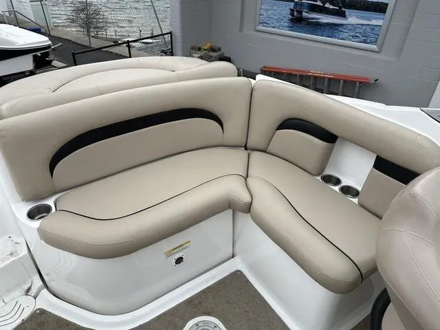 Slide: The Image of 2015 Hurricane SD 2400 I/O boat interior with beige seating and cup holders. - 27