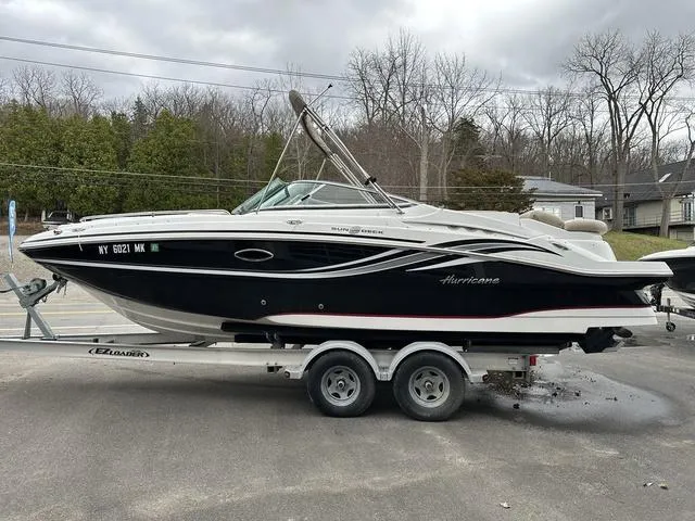 Slide: The Image of 2015 Hurricane SD 2400 I/O boat on trailer, parked outdoors, overcast sky. - 3