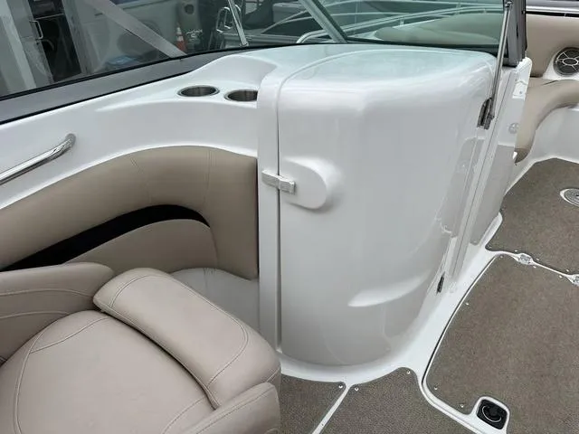 Slide: The Image of 2015 Hurricane SD 2400 I/O boat interior with beige seating and cup holders. - 35