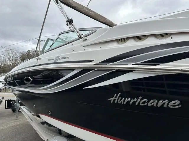 Slide: The Image of 2015 Hurricane SD 2400 I/O boat with sleek black and white design. - 7