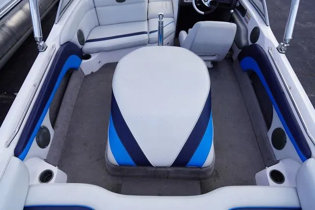 Slide: The Image of 2004 Supra COMP LTS/SK boat interior with blue and white seating and steering wheel. - 10