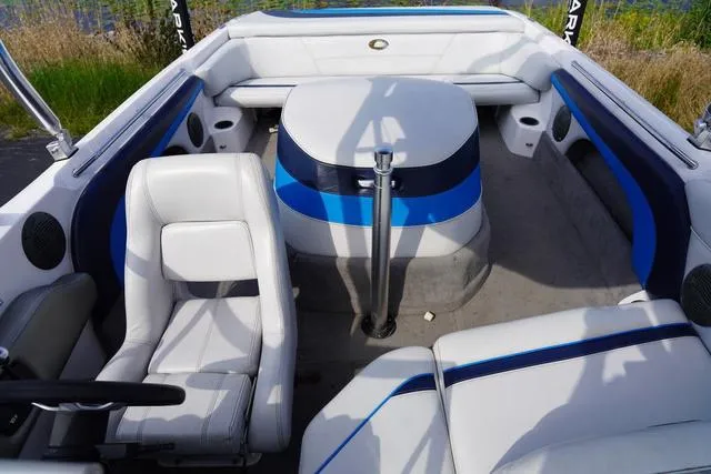Slide: The Image of 2004 Supra COMP LTS/SK boat interior with white and blue seating. - 17