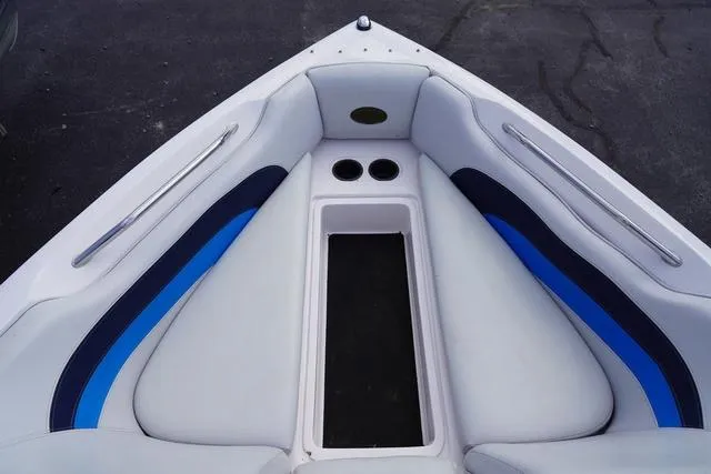 Slide: The Image of 2004 Supra COMP LTS/SK boat interior with white and blue seating. - 20