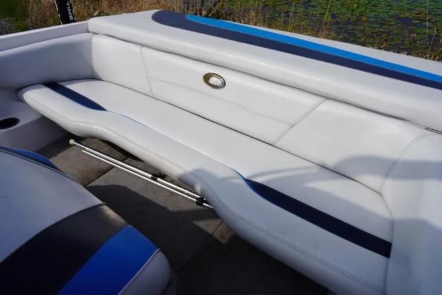 Slide: The Image of 2004 Supra COMP LTS/SK boat interior with white and blue seating. - 24