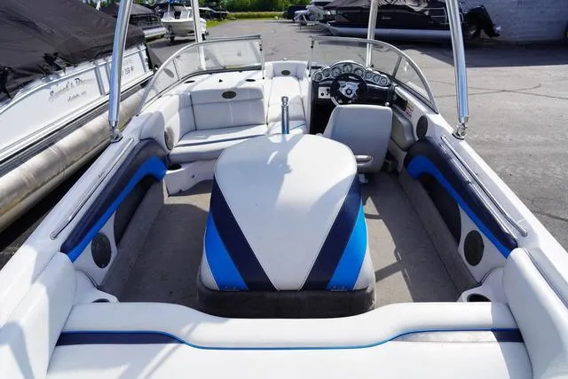 Slide: The Image of 2004 Supra COMP LTS/SK boat interior with blue and white seating and dashboard. - 8