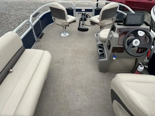 Slide: The Image of 2023 Sun Tracker Bass Buggy® 16 XL Select pontoon boat interior with seating and steering console. - 14