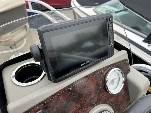 Slide: The Image of Garmin display on 2023 Sun Tracker Bass Buggy® 16 XL Select boat dashboard. - 16