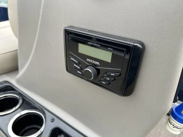 Slide: The Image of Kicker media center on 2023 Sun Tracker Bass Buggy® 16 XL Select boat dashboard. - 17