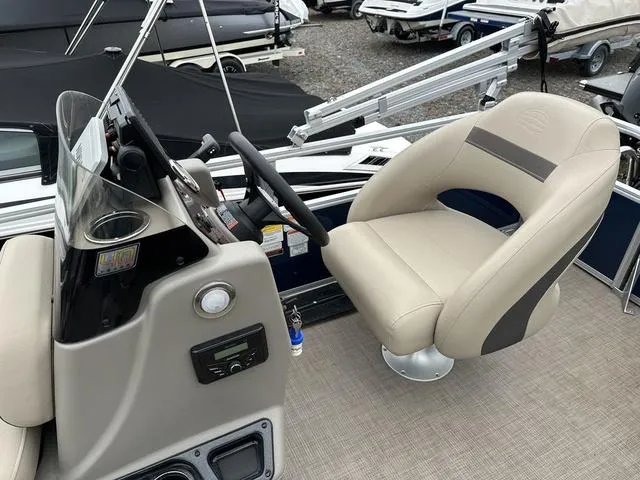 Slide: The Image of 2023 Sun Tracker Bass Buggy® 16 XL Select boat interior with steering console and captain's chair. - 19