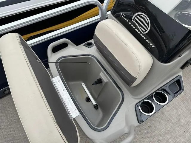 Slide: The Image of 2023 Sun Tracker Bass Buggy® 16 XL Select boat interior with storage compartment and cup holders. - 22