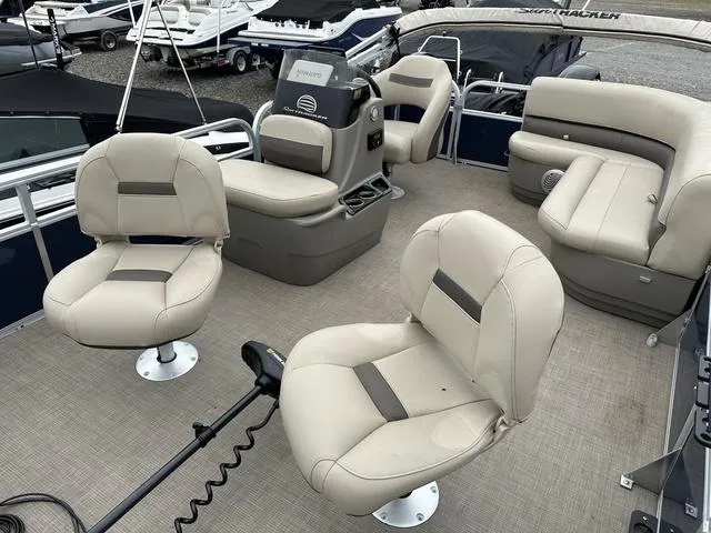 Slide: The Image of 2023 Sun Tracker Bass Buggy® 16 XL Select pontoon boat interior with beige seating. - 27