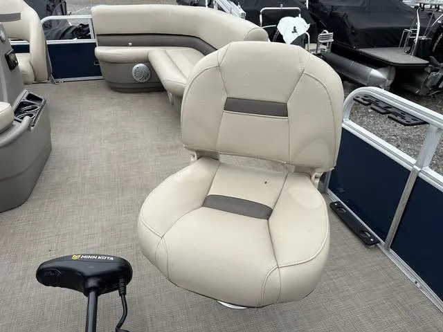 Slide: The Image of 2023 Sun Tracker Bass Buggy® 16 XL Select pontoon boat interior with beige seating. - 28