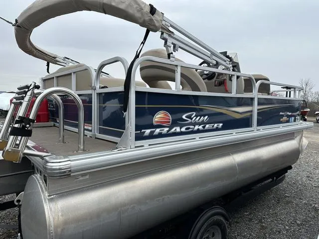 Slide: The Image of 2023 Sun Tracker Bass Buggy® 16 XL Select pontoon boat on trailer. - 3