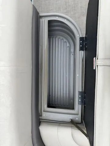 Slide: The Image of Storage compartment on 2023 Sun Tracker Bass Buggy® 16 XL Select boat. - 31