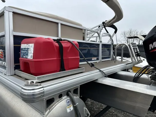 Slide: The Image of 2023 Sun Tracker Bass Buggy® 16 XL Select pontoon boat with red fuel tank on deck. - 5