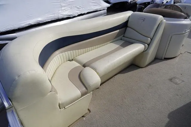 Slide: The Image of 2008 Bennington 2250 boat interior with beige and gray seating. - 14