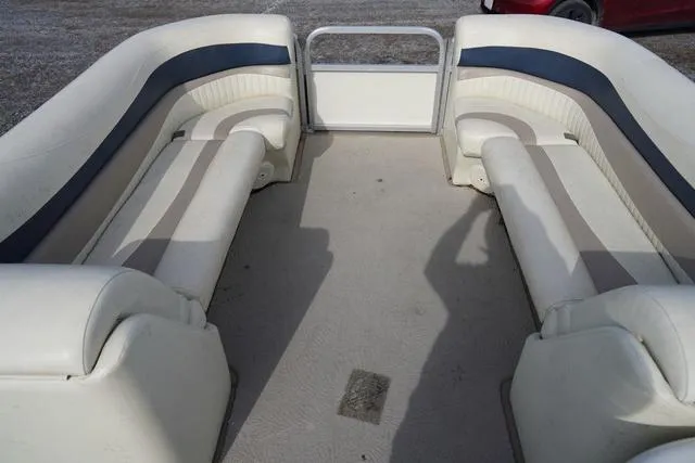 Slide: The Image of 2008 Bennington 2250 boat interior with beige and blue seating. - 23