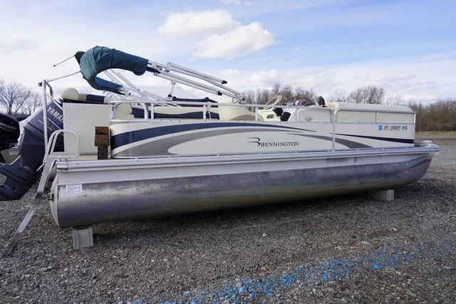 Slide: The Image of 2008 Bennington 2250 pontoon boat on gravel lot, side view. - 4