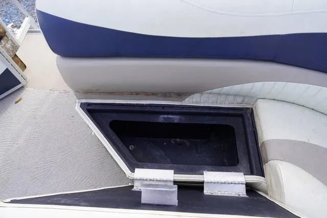 Slide: The Image of Open storage compartment in 2008 Bennington 2250 boat seat. - 6