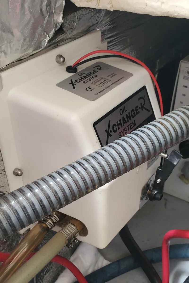 Slide: The Image of 2006 Mainship 34 Rum Runner classic oil X-Change-R system in engine compartment. - 32