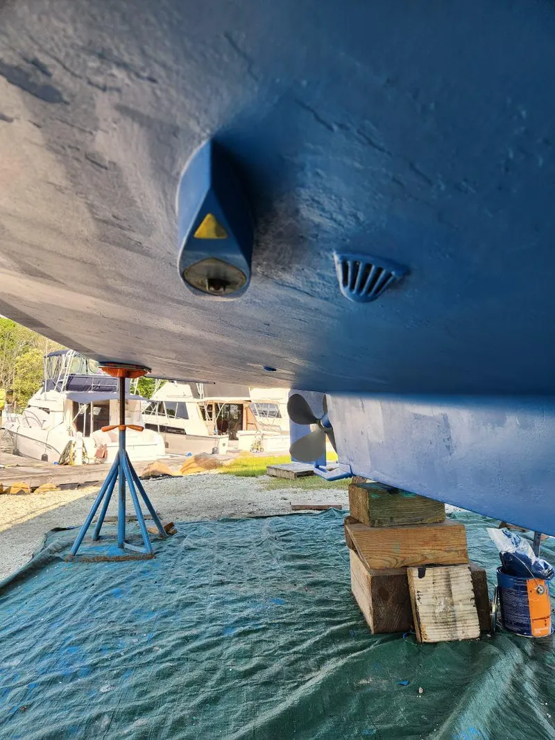 Slide: The Image of Bottom view of 2006 Mainship 34 Rum Runner classic boat on stands. - 37