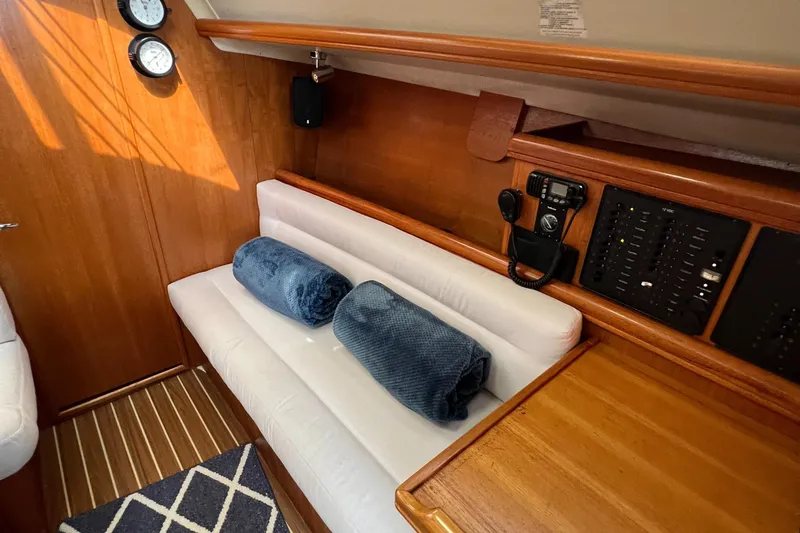 Slide: The Image of Interior of 2005 Hunter 33 sailboat with cozy seating and nautical decor. - 8
