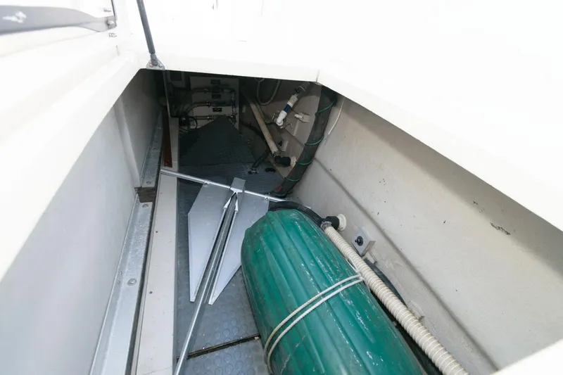 Slide: The Image of Storage compartment in a 2000 Sabreline 47 Motor Yacht with anchor and equipment. - 38