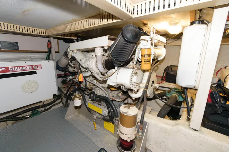 Slide: The Image of Engine room of 2000 Sabreline 47 Motor Yacht with visible generator and machinery. - 40