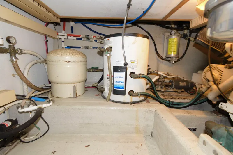 Slide: The Image of Engine room of 2000 Sabreline 47 Motor Yacht with water heater and equipment. - 42