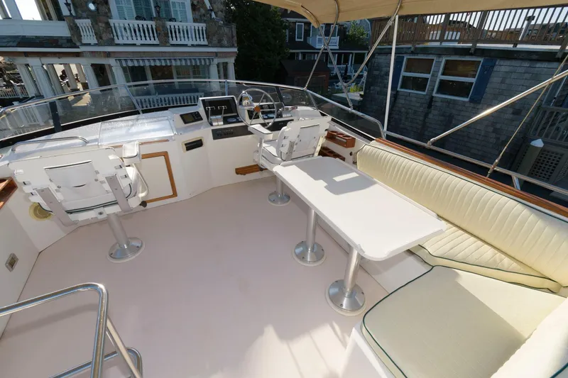 Slide: The Image of Flybridge of 2000 Sabreline 47 Motor Yacht with seating and helm station. - 5