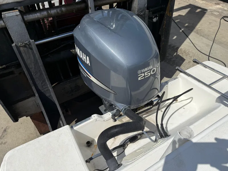 Slide: The Image of 2004 Aquasport 250 Explorer with Yamaha 250 outboard motor. - 19