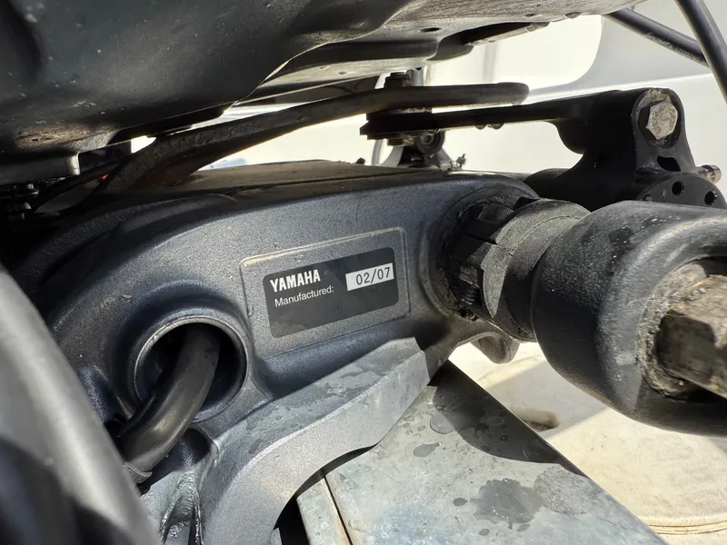 Slide: The Image of Close-up of Yamaha engine component on 2004 Aquasport 250 Explorer boat. - 25