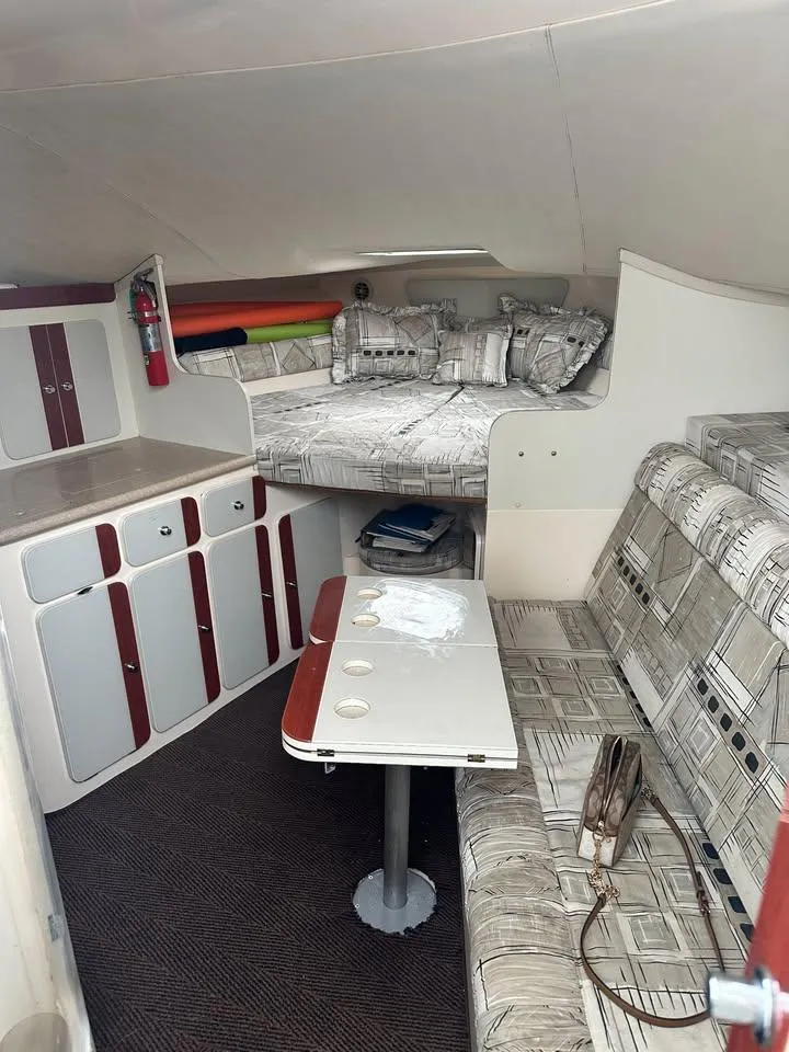 Slide: The Image of Interior of a 1997 Phoenix 32 Tournament boat with seating and sleeping area. - 10