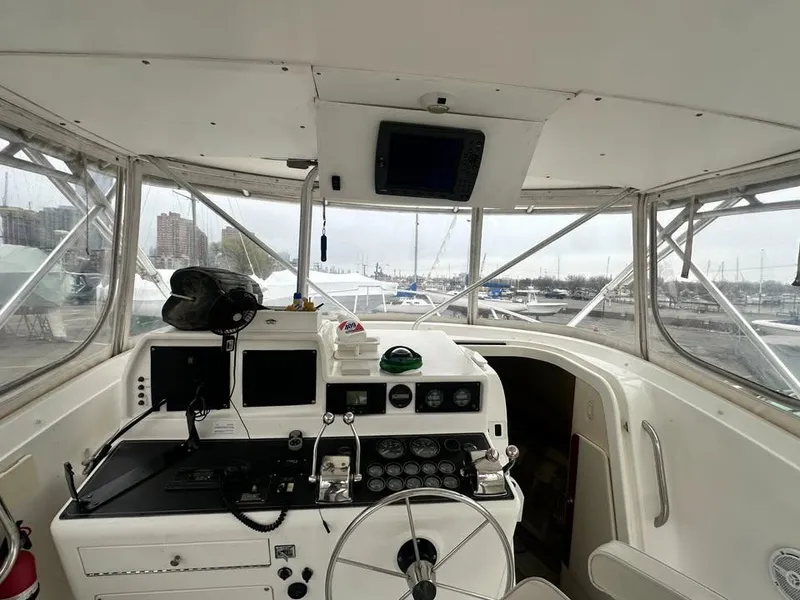 Slide: The Image of Interior view of a 1997 Phoenix 32 Tournament boat cockpit with navigation equipment. - 2