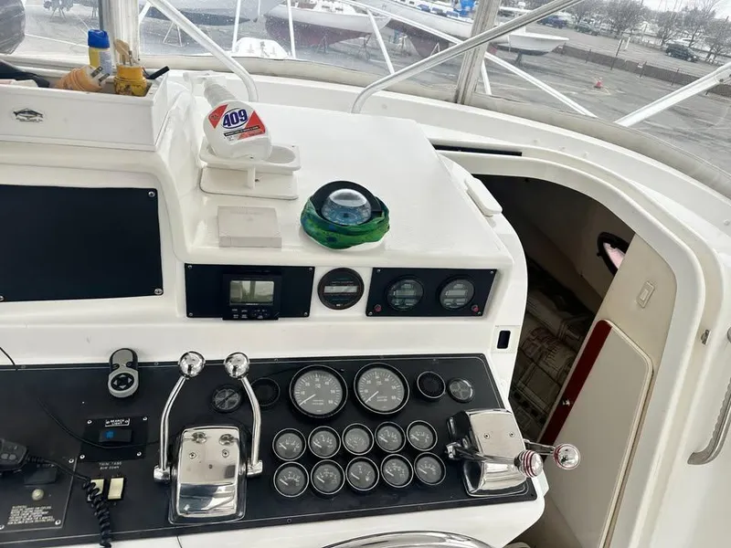 Slide: The Image of 1997 Phoenix 32 Tournament boat dashboard with gauges and controls. - 3