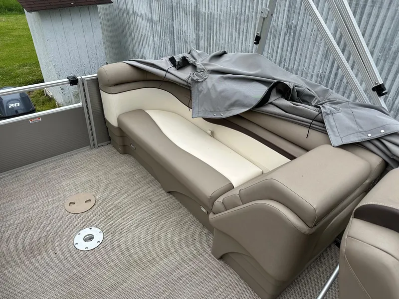 Slide: The Image of 2019 Bennington 22 SSR Quad Bench interior with Yamaha 25Hp engine, covered seating area. - 10