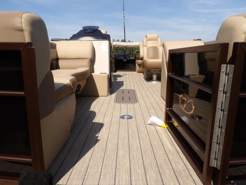 Slide: The Image of 2025 Veranda VR22RC boat interior with beige seating and open deck view. - 5