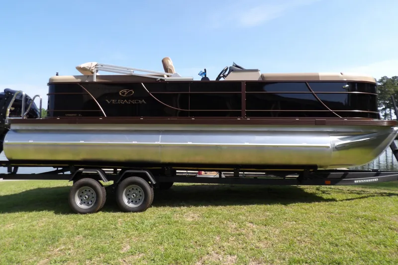 Slide: The Image of 2025 Veranda VR22RC pontoon boat on trailer, parked on grass. - 7