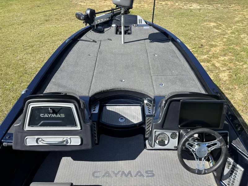 Slide: The Image of 2022 Caymas CX21 Pro boat interior with steering wheel and dashboard controls. - 14