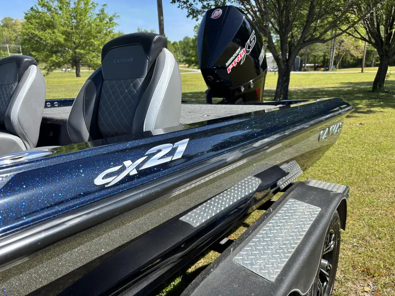 Slide: The Image of 2022 Caymas CX21 Pro boat with sleek design and comfortable seating. - 6