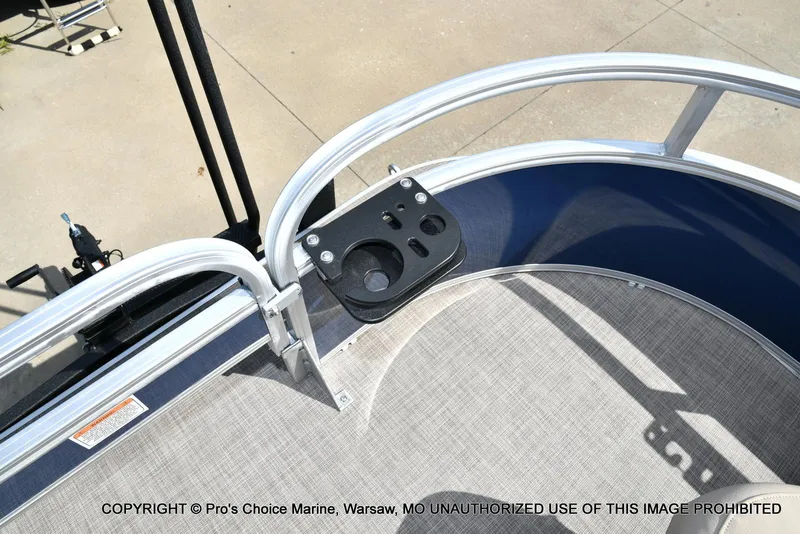 Slide: The Image of 2025 Sun Tracker Bass Buggy 16 XL Select boat deck with cup holder and railing. - 22