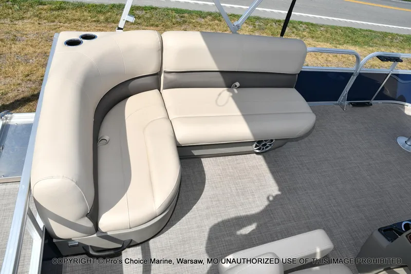 Slide: The Image of 2025 Sun Tracker Bass Buggy 16 XL Select pontoon boat with beige seating and cup holders. - 36