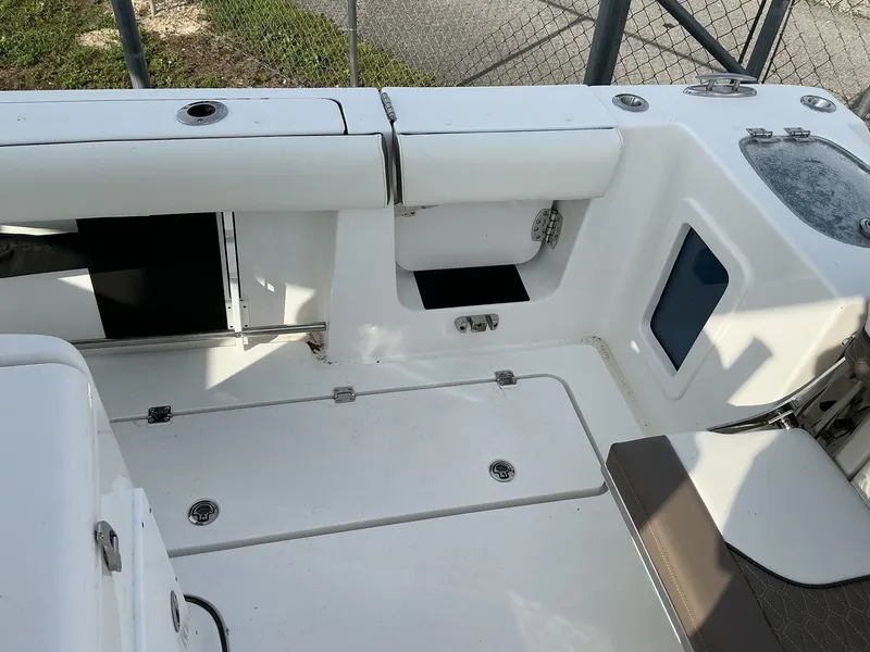 Slide: The Image of 2025 Tidewater 282CC boat interior with storage compartments and seating. - 19