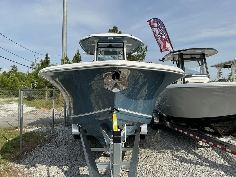Slide: The Image of 2025 Tidewater 282CC boat on trailer, displayed outdoors with clear sky background. - 3