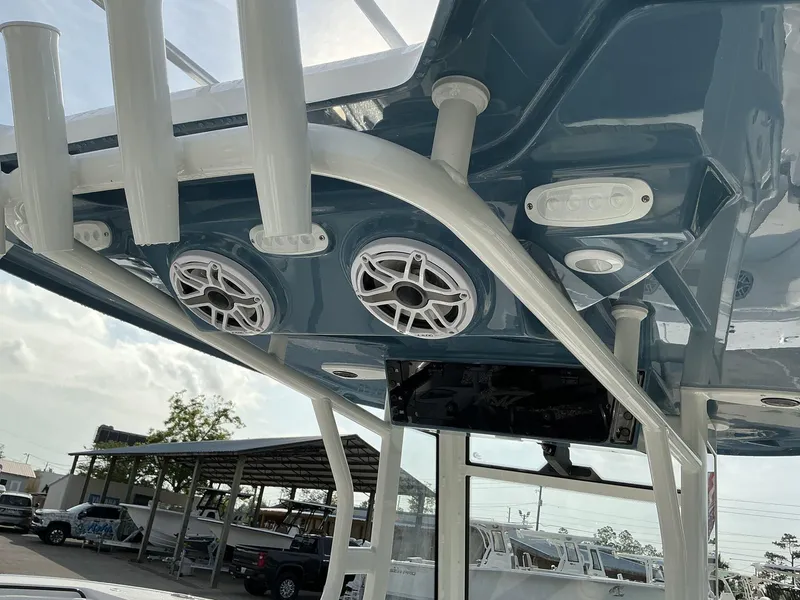 Slide: The Image of 2025 Tidewater 282CC boat interior with speakers and rod holders. - 30