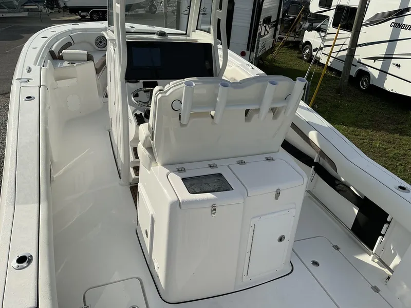 Slide: The Image of 2025 Tidewater 282CC boat interior with helm, seating, and storage compartments. - 9