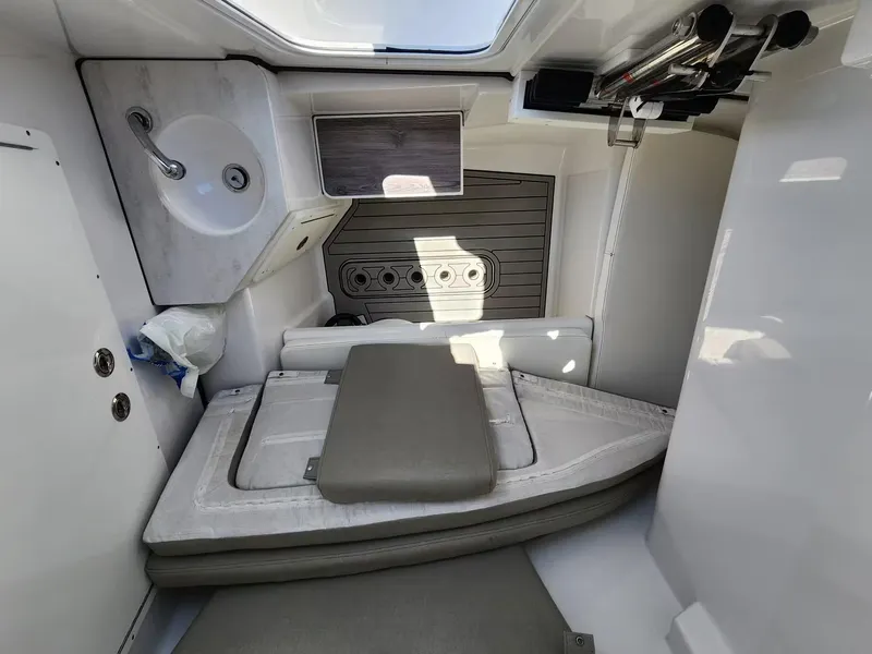 Slide: The Image of 2021 Sportsman 302 CC cabin interior with sink and seating area. - 7