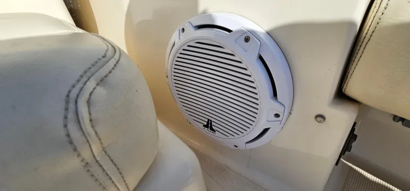 Slide: The Image of Speaker on 1994 Tiara Yachts 3100 Open, near beige seating. - 12